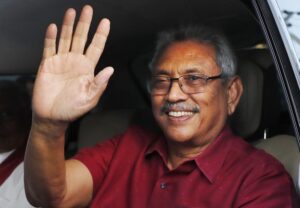 FILE- Sri Lanka’s president elect Gotabaya Rajapaksa waves to supporters as he leaves the election commission after the announcement of his victory in Colombo, Sri Lanka, Sunday, Nov. 17, 2019, file photo. The ousted President is expected to return home Friday, Sept. 2, 2022, more than seven weeks after he fled the country amid mass protests that demanded his resignation, holding him and his family responsible for the country’s economic crisis. (AP Photo/Eranga Jayawardena, File)