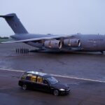 The hearse carrying the coffin of Queen Elizabeth II departs RAF Northolt, from where it will be taken to Buckingham Palace, London, to lie at rest overnight in the Bow Room. Picture date: Tuesday September 13, 2022. Andrew Matthews/Pool via REUTERS