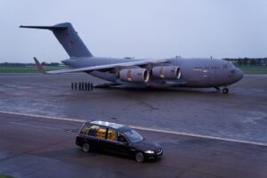 The hearse carrying the coffin of Queen Elizabeth II departs RAF Northolt, from where it will be taken to Buckingham Palace, London, to lie at rest overnight in the Bow Room. Picture date: Tuesday September 13, 2022. Andrew Matthews/Pool via REUTERS