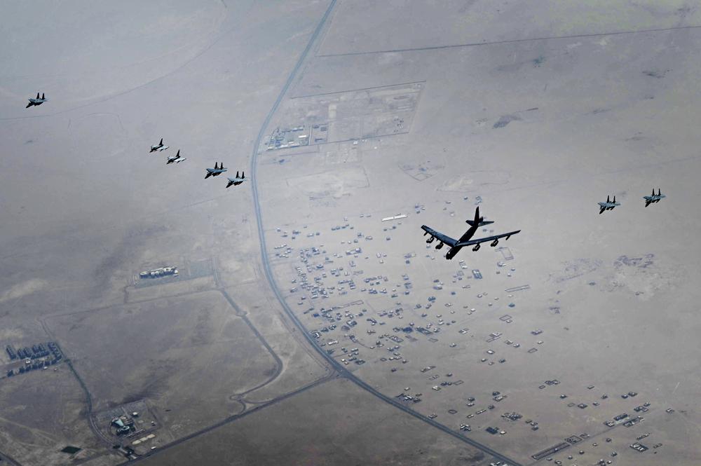 This photo released by the U.S. Air Force shows a B-52H Stratofortress assigned to the 5th Bomb Wing, Minot Air Force Base, North Dakota, flying over the Middle East on Sunday, Sept. 4, 2022. The United States military said Monday it flew a pair of nuclear-capable B-52 long-distance bombers over the Middle East in a show of force, the latest such mission in the region as tensions remain high between Washington and Tehran. (Staff Sgt. Charles Fultz/U.S. Air Force via AP)