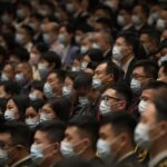 FILE – Delegates wearing masks attend the opening ceremony of the 20th National Congress of China’s ruling Communist Party held at the Great Hall of the People in Beijing, China, Sunday, Oct. 16, 2022. China’s ruling Communist Party said Monday, Oct. 17, 2022, that it has probed almost 5 million members for possible corruption over the last decade, with formal criminal cases brought against 553. (AP Photo/Mark Schiefelbein, File)