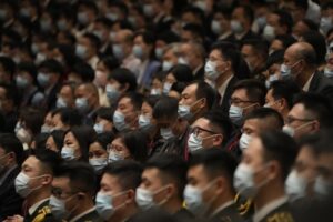 FILE – Delegates wearing masks attend the opening ceremony of the 20th National Congress of China’s ruling Communist Party held at the Great Hall of the People in Beijing, China, Sunday, Oct. 16, 2022. China’s ruling Communist Party said Monday, Oct. 17, 2022, that it has probed almost 5 million members for possible corruption over the last decade, with formal criminal cases brought against 553. (AP Photo/Mark Schiefelbein, File)