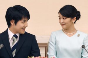 FILE – Japan’s Princess Mako and her fiance Kei Komuro look at each other during a press conference at Akasaka East Residence in Tokyo on Sept. 3, 2017. Komuro has passed the New York bar exam, defying detractors back home who had criticized their romance. (AP Photo/Shizuo Kambayashi, Pool, File)