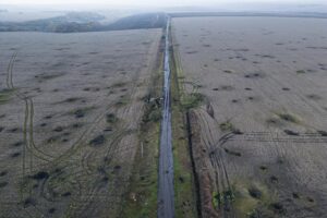 Artillery craters are seen in the field from an arial view in the recently liberated area of Kharkiv region, Ukraine, Friday, Sept. 30, 2022. (AP Photo/Evgeniy Maloletka)