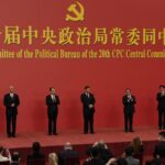 FILE – New members of the Politburo Standing Committee, from left, Li Xi, Cai Qi, Zhao Leji, President Xi Jinping, Li Qiang, Wang Huning, and Ding Xuexiang are introduced at the Great Hall of the People in Beijing on Oct. 23, 2022. The world faces the prospect of more tension with China over trade, security and human rights after Xi Jinping awarded himself a third five-year term on Oct. 23, 2022 as leader of the ruling Communist Party. (AP Photo/Ng Han Guan, File)