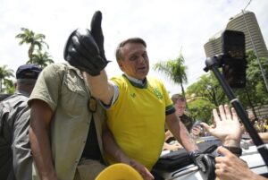 Brazil’s President Jair Bolsonaro flashes a thumbs up as he greets supporters during a campaign rally in Praca da Liberdade or Liberty Square, in Belo Horizonte, Brazil, Saturday, Oct. 29, 2022. Bolsonaro is facing former President Luiz Inacio Lula da Silva in a runoff election set for Oct. 30. (AP Photo/Yuri Laurindo)