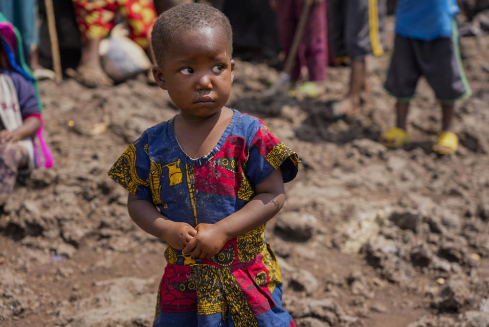 Pasika Bagerimana’s daughter Mahigwe stands outside a temporary shelter she shares with others who fled fighting, in Nyiragongo, Democratic Republic of Congo, Aug. 31, 2022. Bagerimana, who lost two children to hunger, worries her remaining two children might be next. “Hunger is killing people,” she says. Hunger is soaring across parts of Congo’s war-torn North Kivu province where the fighting between M23 rebels and government soldiers has been raging since March, according to aid workers, civilians and health workers. (AP Photo/Sam Mednick)