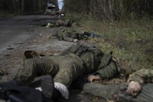 EDS NOTE: GRAPHIC CONTENT – Dead bodies of Russian servicemen lie on the ground in recently recaptured town of Lyman, Ukraine, Monday, Oct. 3, 2022. (AP Photo/Evgeniy Maloletka)