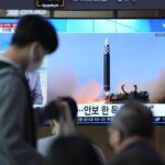 A TV screen showing a news program reporting about North Korea’s missile launch with file footage, is seen at the Seoul Railway Station in Seoul, South Korea, Sunday, Oct. 9, 2022. North Korea fired two short-range ballistic missiles toward its eastern waters on Sunday, the latest of a recent barrage of weapons tests, a day after it warned the redeployment of a U.S. aircraft carrier near the Korean Peninsula was inflaming regional tensions. (AP Photo/Lee Jin-man)