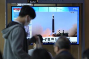 A TV screen showing a news program reporting about North Korea’s missile launch with file footage, is seen at the Seoul Railway Station in Seoul, South Korea, Sunday, Oct. 9, 2022. North Korea fired two short-range ballistic missiles toward its eastern waters on Sunday, the latest of a recent barrage of weapons tests, a day after it warned the redeployment of a U.S. aircraft carrier near the Korean Peninsula was inflaming regional tensions. (AP Photo/Lee Jin-man)