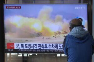 A TV screen shows a file image of North Korea’s military exercise during a news program at the Seoul Railway Station in Seoul, South Korea, Wednesday, Oct. 19, 2022. North Korea fired artillery shells near its sea boundaries with South Korea late Tuesday, a day after the South began annual military drills to better deal with North Korean provocations. (AP Photo/Ahn Young-joon)
