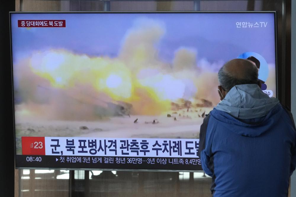 A TV screen shows a file image of North Korea’s military exercise during a news program at the Seoul Railway Station in Seoul, South Korea, Wednesday, Oct. 19, 2022. North Korea fired artillery shells near its sea boundaries with South Korea late Tuesday, a day after the South began annual military drills to better deal with North Korean provocations. (AP Photo/Ahn Young-joon)