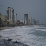 Skies are dark along the coast of Mazatlan, Mexico, early Monday, Oct. 3, 2022, as Hurricane Orlene approaches. The storm is heading for Mexico’s northwest Pacific coast between Mazatlan and San Blas. (AP Photo/Fernando Llano)