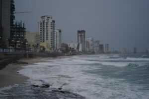 Skies are dark along the coast of Mazatlan, Mexico, early Monday, Oct. 3, 2022, as Hurricane Orlene approaches. The storm is heading for Mexico’s northwest Pacific coast between Mazatlan and San Blas. (AP Photo/Fernando Llano)