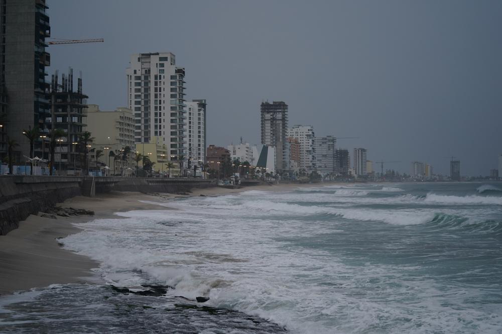 Skies are dark along the coast of Mazatlan, Mexico, early Monday, Oct. 3, 2022, as Hurricane Orlene approaches. The storm is heading for Mexico’s northwest Pacific coast between Mazatlan and San Blas. (AP Photo/Fernando Llano)
