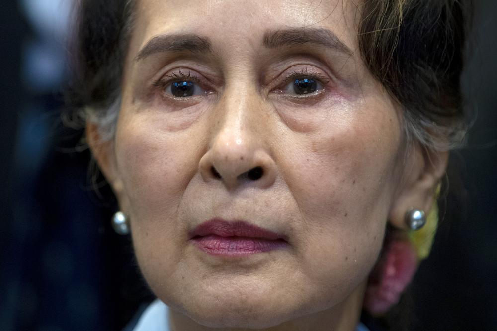 FILE – Myanmar’s lthen eader Aung San Suu Kyi waits to address judges of the International Court of Justice on the second day of three days of hearings in The Hague, Netherlands, Dec. 11, 2019. Myanmar convicted ousted leader Aung San Suu Kyi on two more corruption counts on Wednesday, Oct. 12, 2022, extending her total prison term to 26 years. (AP Photo/Peter Dejong, File)