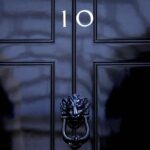 FILE – The door to 10 Downing Street in London, Friday, July 8, 2022. Under Britain’s parliamentary system, the public never actually votes for its prime minister. Instead, voters tick the box for a representative from their local area, who then becomes one of Britain’s 650 Members of Parliament. The party that wins a majority forms a government and puts their leader into the prime minister’s seat. (AP Photo/Frank Augstein, File)