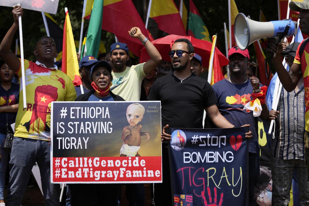 FILE – Members of the Tigrayan community protest against the conflict between Ethiopia and Tigray rebels in Ethiopia’s northern Tigray region, outside the the United Arab Emirates embassy in Pretoria, South Africa on Oct. 12, 2022. A South Africa government spokesman says African Union-led peace talks to end Ethiopia’s Tigray conflict have begun in South Africa on Tuesday, Oct. 25, 2022. (AP Photo/Themba Hadebe, File)