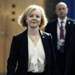 Britain’s Prime Minister Liz Truss, centre, arrives for the Conservative Party annual conference at the International Convention Centre in Birmingham, England, Monday, Oct. 3, 2022. (Aaron Chown/PA via AP)