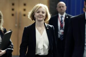 Britain’s Prime Minister Liz Truss, centre, arrives for the Conservative Party annual conference at the International Convention Centre in Birmingham, England, Monday, Oct. 3, 2022. (Aaron Chown/PA via AP)