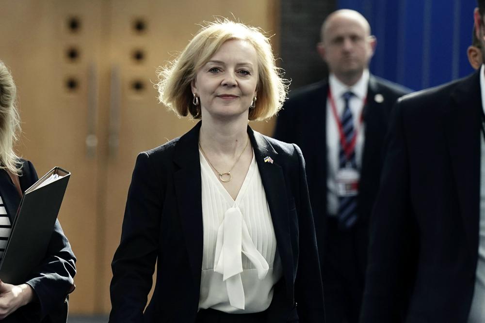 Britain’s Prime Minister Liz Truss, centre, arrives for the Conservative Party annual conference at the International Convention Centre in Birmingham, England, Monday, Oct. 3, 2022. (Aaron Chown/PA via AP)