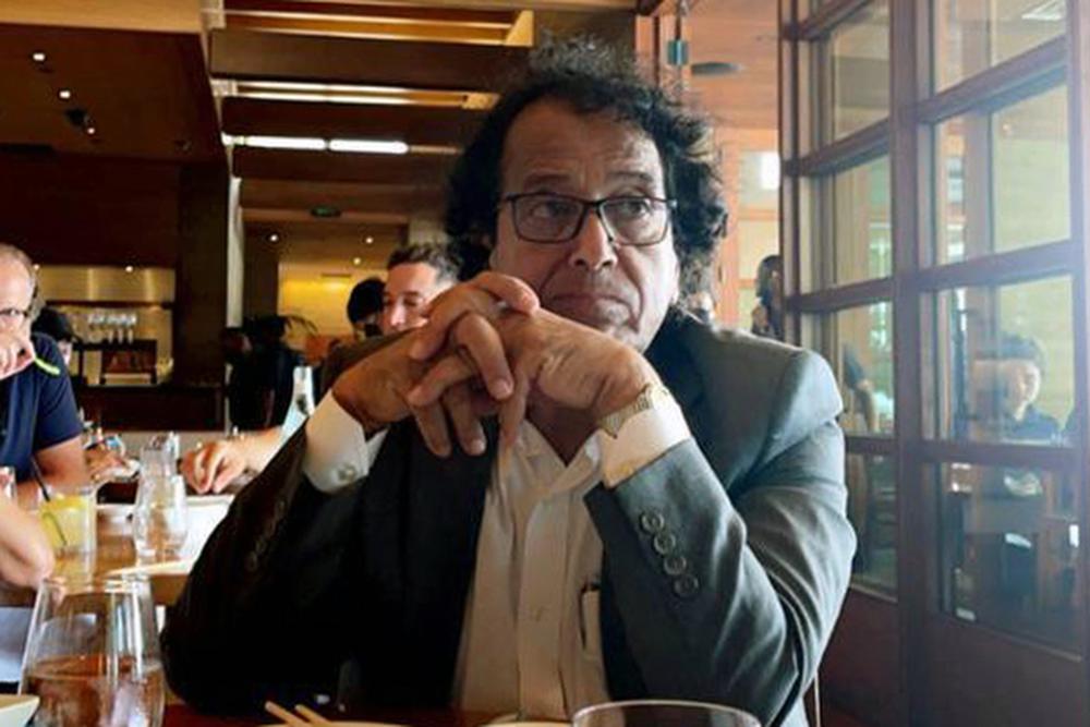 In this photo provided by Ibrahim Almadi, Saad Ibrahim Almadi sits in a restaurant in an unidentified place, in the United States, on August 2021. Almadi, 72, who is a citizen of both Saudi Arabia and the U.S., was arrested in Saudi Arabia last November and was recently sentenced to 16 years in prison over tweets critical of the Saudi government. (Ibrahim Almadi via AP)