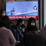 A TV screen shows a file image of South Korean navy vessels during a news program at the Seoul Railway Station in Seoul, South Korea, Monday, Oct. 24, 2022. The rival Koreas exchanged warning shots along their disputed western sea boundary on Monday, their militaries said, amid heightened animosities over North Korea’s recent barrage of weapons tests. (AP Photo/Ahn Young-joon)