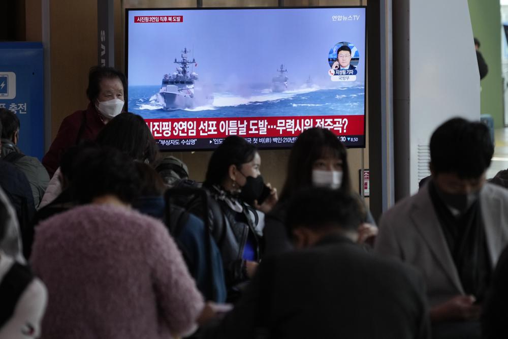 A TV screen shows a file image of South Korean navy vessels during a news program at the Seoul Railway Station in Seoul, South Korea, Monday, Oct. 24, 2022. The rival Koreas exchanged warning shots along their disputed western sea boundary on Monday, their militaries said, amid heightened animosities over North Korea’s recent barrage of weapons tests. (AP Photo/Ahn Young-joon)
