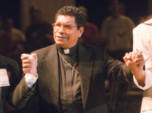 FILE – Bishop Carlos Ximenes Belo of East Timor, sings along with participants at the National Catholic Gathering for Jubilee Justice held on the UCLA Campus in Los Angeles, on July 17, 1999. Belo has been accused in a Dutch magazine article of sexually abusing boys in East Timor in the 1990s, rocking the Catholic Church in the impoverished nation and forcing officials at the Vatican and his religious order to scramble to provide answers. (AP Photo/Neil Jacobs, File)