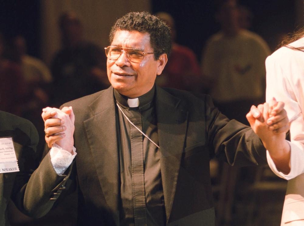 FILE – Bishop Carlos Ximenes Belo of East Timor, sings along with participants at the National Catholic Gathering for Jubilee Justice held on the UCLA Campus in Los Angeles, on July 17, 1999. Belo has been accused in a Dutch magazine article of sexually abusing boys in East Timor in the 1990s, rocking the Catholic Church in the impoverished nation and forcing officials at the Vatican and his religious order to scramble to provide answers. (AP Photo/Neil Jacobs, File)