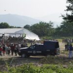 Migrants, mostly from Venezuela, arrive at a camp where Mexican authorities will arrange permits for their continued travel north, in San Pedro Tapanatepec, Oaxaca, Mexico Wednesday, Oct. 5, 2022. As migrants, especially Venezuelans, struggle to come to terms with a new U.S. policy discouraging border crossings, the town of San Pedro Tapanatepec is unexpectedly playing host to over 10,000 migrants camped far from the U.S. border. (AP Photo/Marco Ugarte)