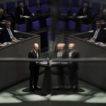 German Chancellor Olaf Scholz addresses the German parliament Bundestag ahead of an EU summit at the Reichstag building in Berlin, Germany, Thursday, Oct. 20, 2022. (AP Photo/Markus Schreiber)