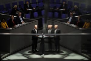 German Chancellor Olaf Scholz addresses the German parliament Bundestag ahead of an EU summit at the Reichstag building in Berlin, Germany, Thursday, Oct. 20, 2022. (AP Photo/Markus Schreiber)