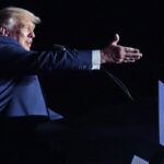 FILE – Former President Donald Trump speaks at a rally, Friday, Sept. 23, 2022, in Wilmington, N.C. On Monday, Oct. 24, 2022, Trump’s company goes on trial in a criminal tax case and the first task facing the court is a big one: Picking a neutral jury. (AP Photo/Chris Seward, File)