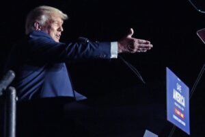 FILE – Former President Donald Trump speaks at a rally, Friday, Sept. 23, 2022, in Wilmington, N.C. On Monday, Oct. 24, 2022, Trump’s company goes on trial in a criminal tax case and the first task facing the court is a big one: Picking a neutral jury. (AP Photo/Chris Seward, File)