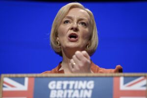 FILE – Britain’s Prime Minister Liz Truss makes a speech at the Conservative Party conference at the ICC in Birmingham, England, Oct. 5, 2022. After an acrimonious divorce and years of bickering, Britain’s government looks like it wants to make up with the European Union. On Thursday, Oct. 6 Truss travels to the Czech Republic to attend the first meeting of the European Political Community, an initiative of French President Emmanuel Macron that brings together EU members and countries outside the union. (AP Photo/Kirsty Wigglesworth, file)