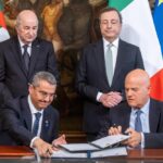 FILE – Italian Prime Minister Mario Draghi, background right, stands next to Algerian President Abdelmadjid Tebboune, background left, as Sonatrach chairman and chief executive Toufik Hakkar, left, and ENI CEO Claudio Descalzi sign an agreement on gas supplies, at Rome’s Palazzo Chigi premier office, on May 26, 2022. European leaders are turning to Africa for more natural gas as the EU tries to replace Russian exports amid the war in Ukraine. (Mauro Scrobogna/LaPresse via AP, File)