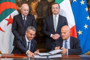 FILE – Italian Prime Minister Mario Draghi, background right, stands next to Algerian President Abdelmadjid Tebboune, background left, as Sonatrach chairman and chief executive Toufik Hakkar, left, and ENI CEO Claudio Descalzi sign an agreement on gas supplies, at Rome’s Palazzo Chigi premier office, on May 26, 2022. European leaders are turning to Africa for more natural gas as the EU tries to replace Russian exports amid the war in Ukraine. (Mauro Scrobogna/LaPresse via AP, File)