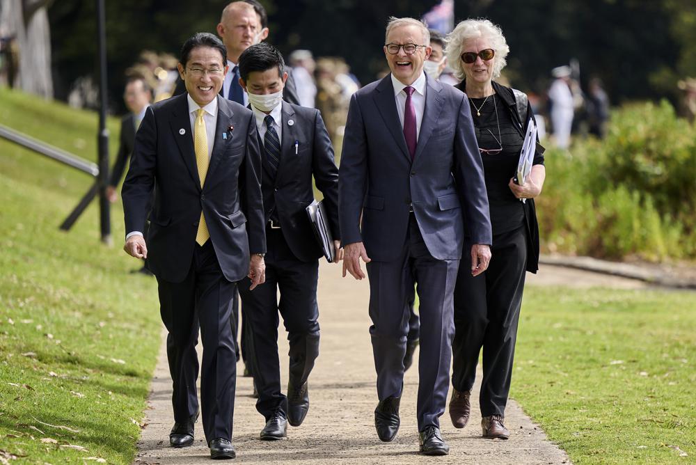Japan’s Prime Minister Fumio Kishida, front left, walks with Australian Prime Minister Anthony Albanese, front right, during a visit to Kings Park in Perth, Australia, Saturday, Oct. 22, 2022. Kishida visit is to bolster military and energy cooperation between Australia and Japan amid their shared concerns about China. (Stefan Gosatti/Pool Photo via AP)