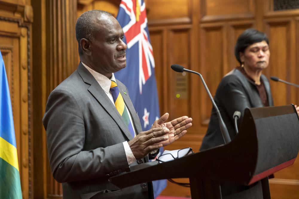 Solomon Islands Foreign Minister Jeremiah Manele, left, and New Zealand Foreign Minister Nanaia Mahuta during their joint media conference at Parliament in Wellington, New Zealand, Tuesday, Oct. 4, 2022. Solomon Islands agreed to sign an accord between the United States and more than a dozen Pacific nations only after indirect references to China were removed, the Solomon Islands foreign minister said Tuesday. (Mark Mitchell/New Zealand Herald via AP)