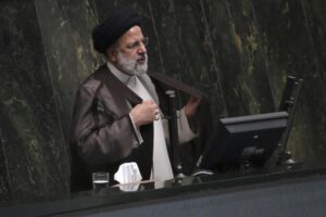 Iranian President Ebrahim Raisi addresses the parliament in a vote of confidence session for his proposed labor minister in Tehran, Iran, Tuesday, Oct. 4, 2022. (AP Photo/Vahid Salemi)