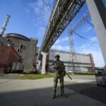 FILE – A Russian serviceman guards in an area of the Zaporizhzhia Nuclear Power Station in territory under Russian military control, southeastern Ukraine, on May 1, 2022. Ukraine’s Zaporizhzhia nuclear power plant, the biggest in Europe, has lost its last remaining external power source as a result of renewed shelling and is now relying on emergency diesel generators, the U.N. nuclear watchdog said Saturday, Oct. 8, 2022. (AP Photo, File)