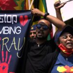Members of the Tigrayan community protest against the conflict between Ethiopia and Tigray rebels in Ethiopia’s Tigray region, outside the the United Arab Emirates embassy in Pretoria, South Africa, Wednesday, Oct. 12, 2022. Tigray rebels and Ethiopia’s federal government were scheduled to participate in African Union-brokered peace talks in South Africa on Oct. 8 but they were delayed while logistical issues and security arrangements are being ironed out. (AP Photo/Themba Hadebe)