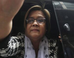 FILE – Philippine then opposition Senator Leila de Lima arrives at a regional trial court for a brief personal appearance Friday, Feb. 24, 2017, in Paranaque city southeast of Manila, Philippines. Philippine police killed three inmates, including a top Abu Sayyaf militant, after they stabbed a jail officer and briefly held a detained former opposition Senator Leila de Lima Sunday in a failed attempt to escape from the police headquarters in the capital region, police said. (AP Photo, File)