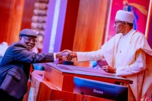Buhari swears Ariwoola