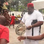 Chief Emeka Agba welcoming a masquerade during the New Yam Festival