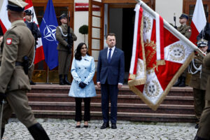 Canadian Defence Minister Anand and her Polish counterpart Blaszczak review honor guard during welcoming ceremony in Warsaw