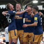 Sean Longstaff (left) celebrates with his Newcastle team-mates after scoring their third goal
