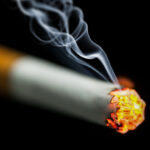 burning cigarette with smoke