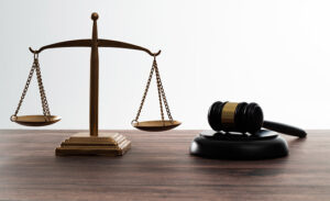 Gavel and scales of justice on the table.